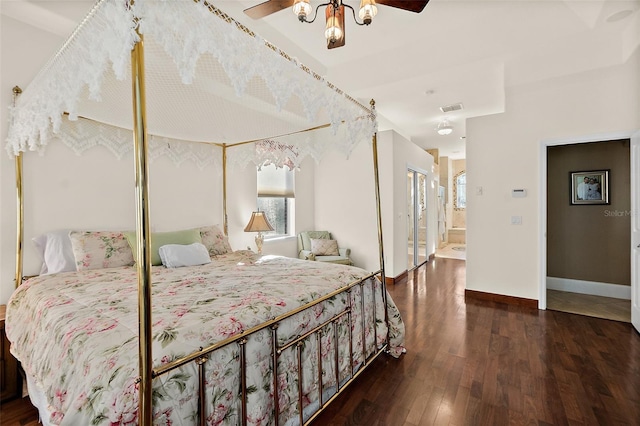 bedroom with ceiling fan, ensuite bathroom, dark wood-type flooring, and a closet