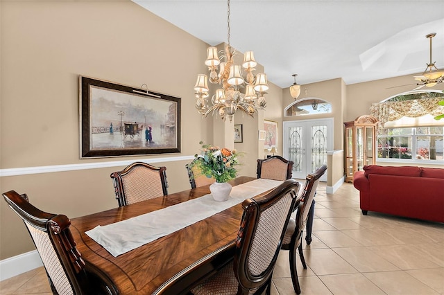 dining area featuring french doors, light tile patterned floors, and an inviting chandelier