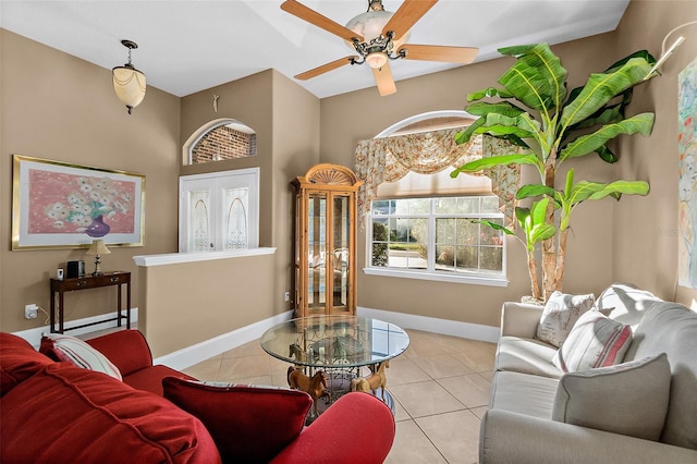 living room featuring ceiling fan and light tile patterned flooring