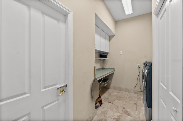 interior space with cabinets and washer and dryer