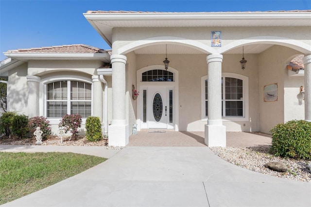 entrance to property featuring a porch