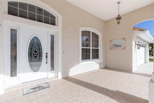 property entrance with a garage