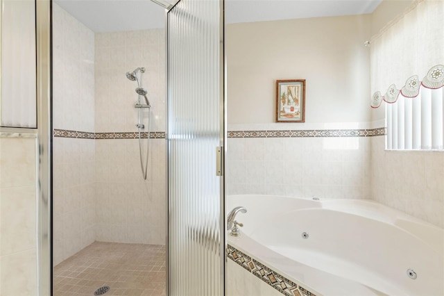 bathroom featuring plus walk in shower