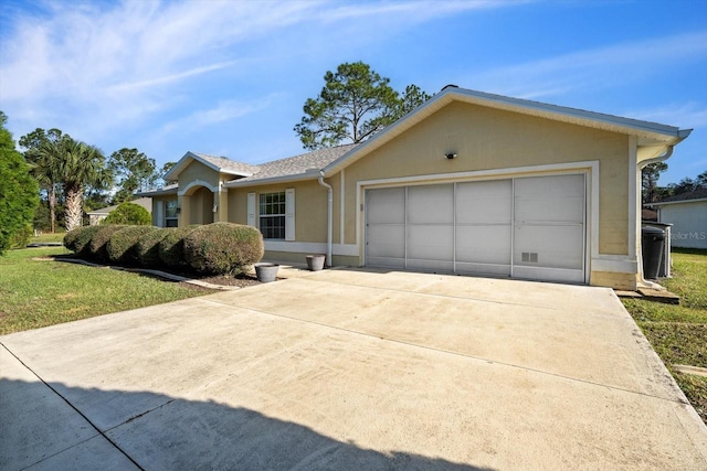 ranch-style home with a front yard and a garage