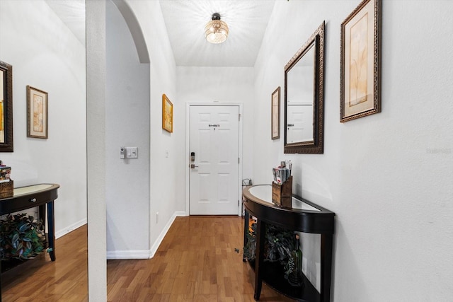 corridor featuring hardwood / wood-style floors