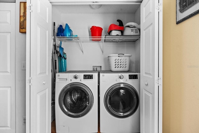 laundry room featuring washing machine and dryer