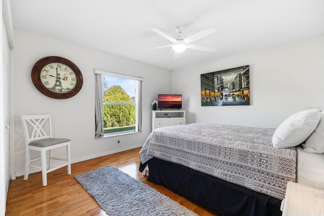 bedroom featuring ceiling fan and wood-type flooring