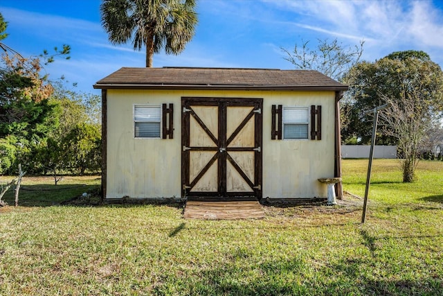 view of outdoor structure with a yard