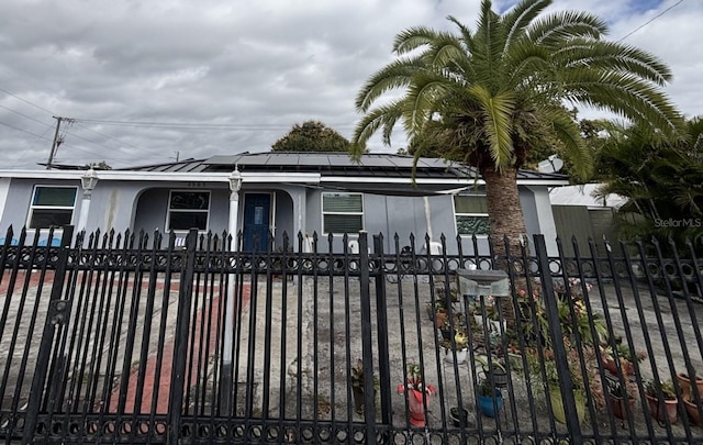 view of gate with solar panels