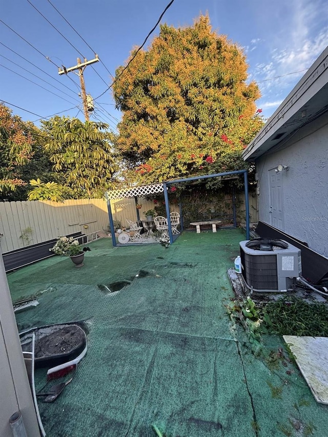 view of yard with central AC