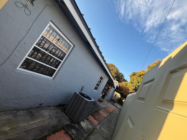 view of property exterior featuring central AC