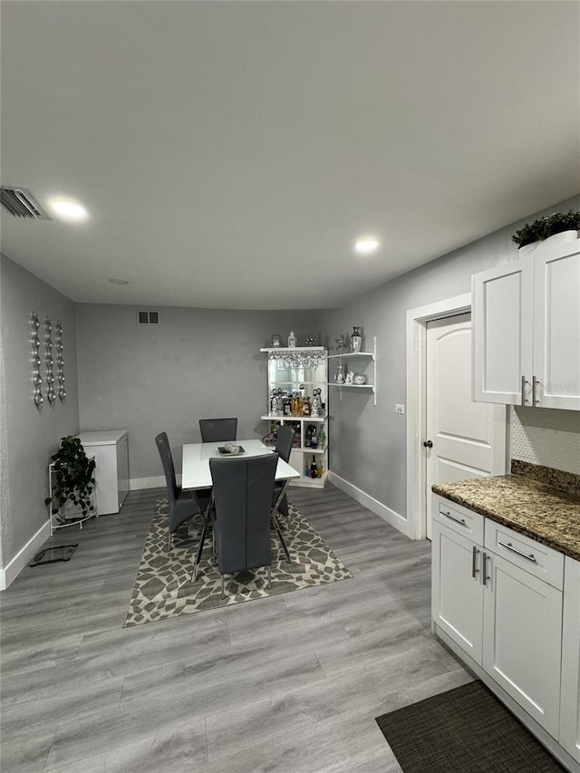 3565 NW 81st Ter, Miami, FL 33147 - dining space with light wood finished floors, visible vents, and baseboards