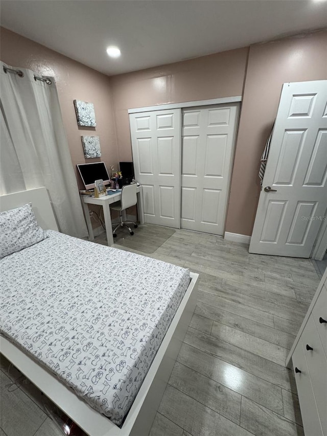 3565 NW 81st Ter, Miami, FL 33147 - bedroom with light wood-style floors, a closet, and recessed lighting