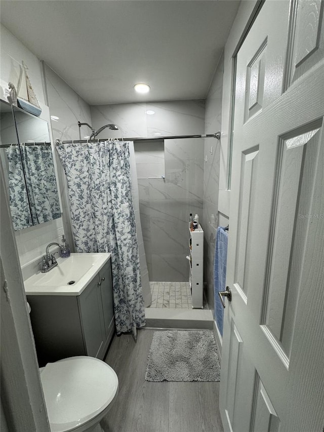 3565 NW 81st Ter, Miami, FL 33147 - full bath featuring toilet, a shower stall, wood finished floors, and vanity