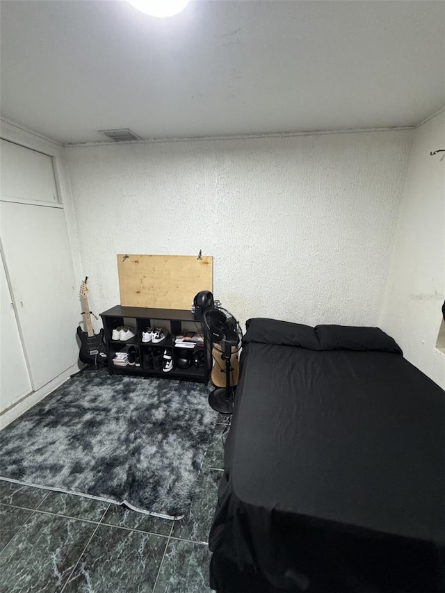 3565 NW 81st Ter, Miami, FL 33147 - bedroom with visible vents and a textured wall