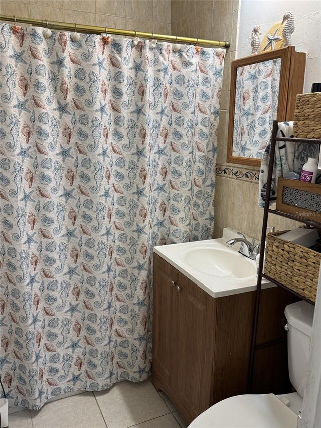 3565 NW 81st Ter, Miami, FL 33147 - full bathroom featuring toilet, a shower with curtain, vanity, and tile patterned floors