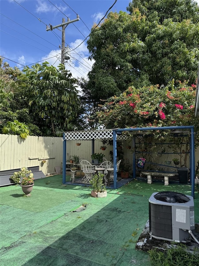 3565 NW 81st Ter, Miami, FL 33147 - view of yard featuring a fenced backyard and central air condition unit