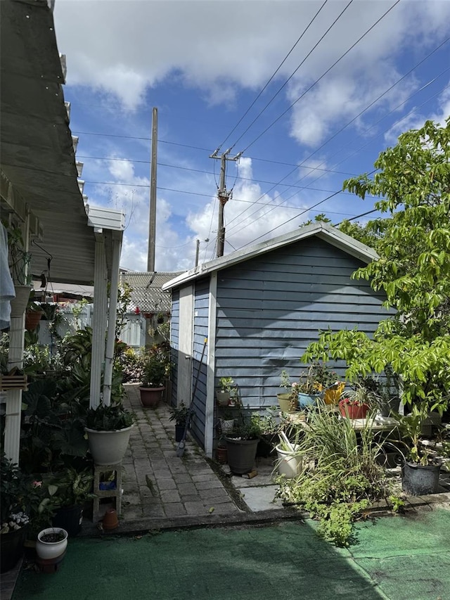 3565 NW 81st Ter, Miami, FL 33147 - view of side of home with a patio area