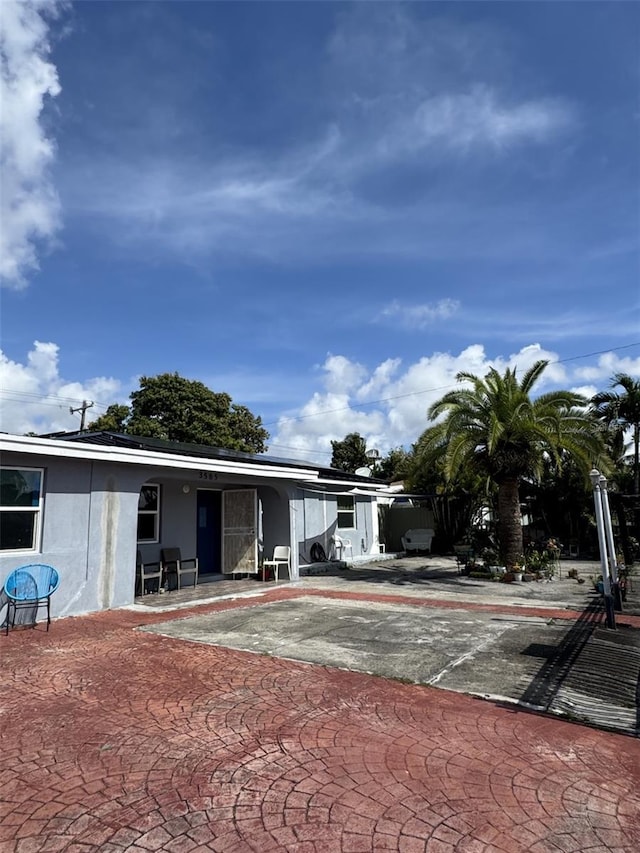 3565 NW 81st Ter, Miami, FL 33147 - view of front of home featuring a patio and stucco siding