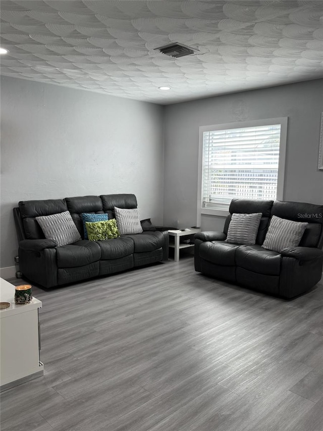 3565 NW 81st Ter, Miami, FL 33147 - living room featuring light wood-type flooring and visible vents