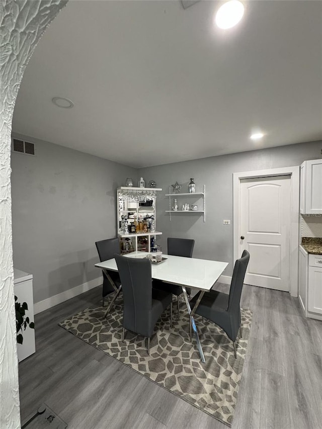 3565 NW 81st Ter, Miami, FL 33147 - dining room featuring visible vents, baseboards, wood finished floors, and recessed lighting
