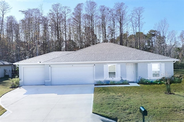 ranch-style home with a garage and a front lawn