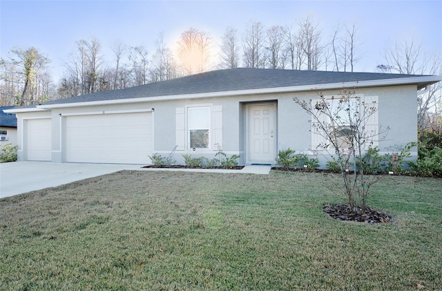 single story home featuring a garage and a front yard