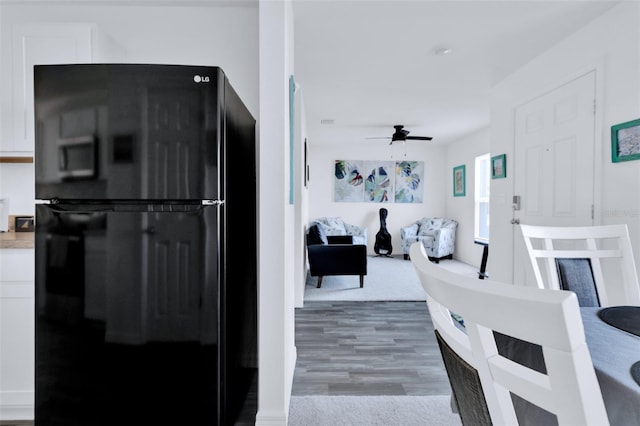 interior space with ceiling fan and hardwood / wood-style floors