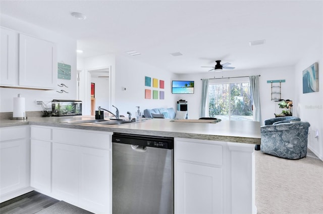 kitchen with white cabinetry, stainless steel dishwasher, and sink