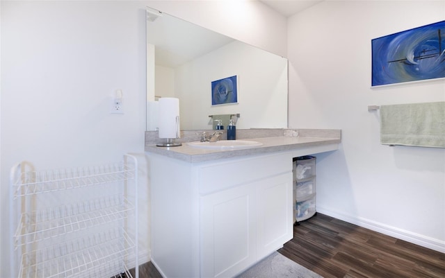 bathroom featuring wood-type flooring and vanity