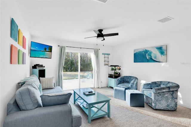 living room with ceiling fan and carpet floors