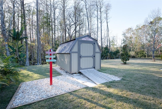 view of outdoor structure with a lawn