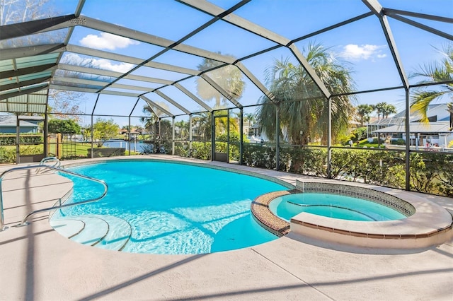 view of pool with glass enclosure and an in ground hot tub