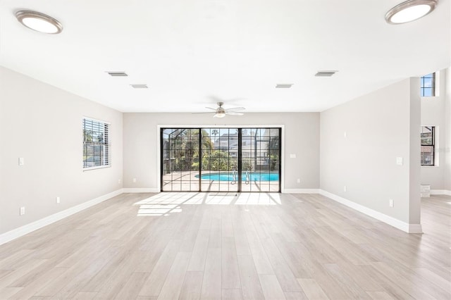 unfurnished room featuring light hardwood / wood-style flooring and ceiling fan