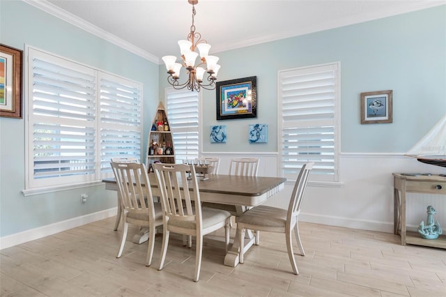 dining room with a notable chandelier and ornamental molding