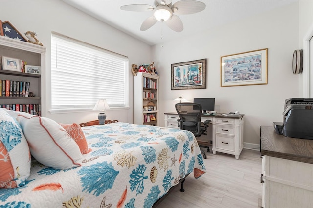 bedroom with light hardwood / wood-style flooring and ceiling fan