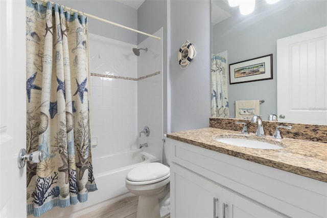 full bathroom featuring shower / bath combination with curtain, toilet, and vanity