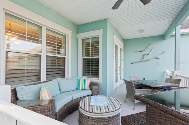 balcony with outdoor lounge area and ceiling fan