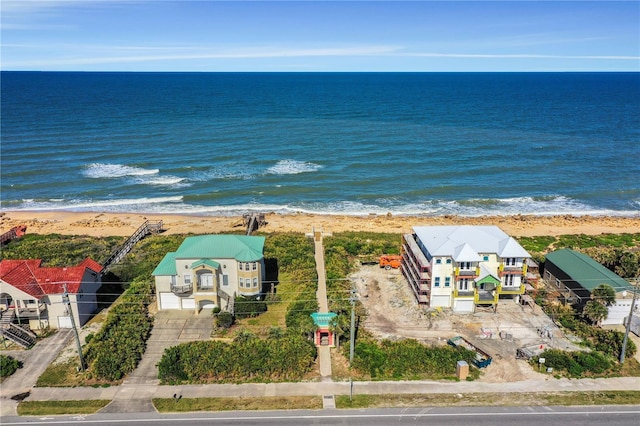 aerial view featuring a water view and a view of the beach