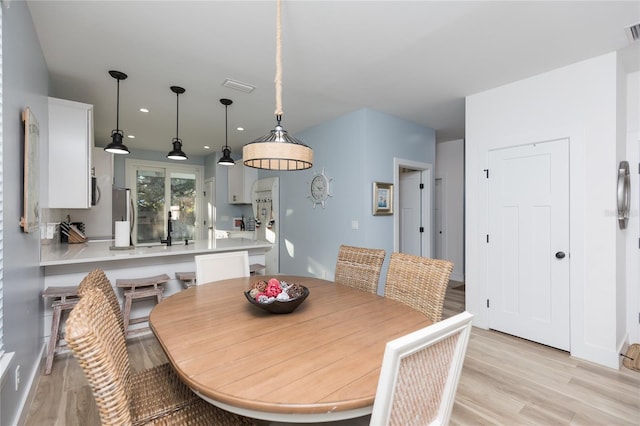 dining area featuring light hardwood / wood-style floors