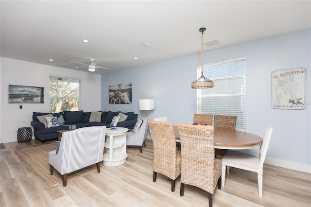 dining area featuring ceiling fan and light wood-type flooring