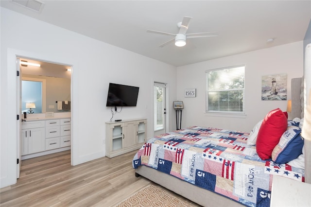 bedroom with ensuite bath, ceiling fan, and light hardwood / wood-style floors