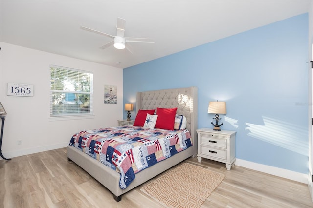 bedroom featuring ceiling fan and light hardwood / wood-style floors