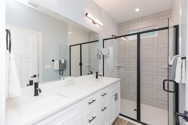 bathroom with vanity and an enclosed shower