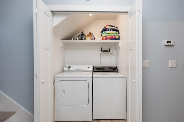 clothes washing area featuring washer and dryer