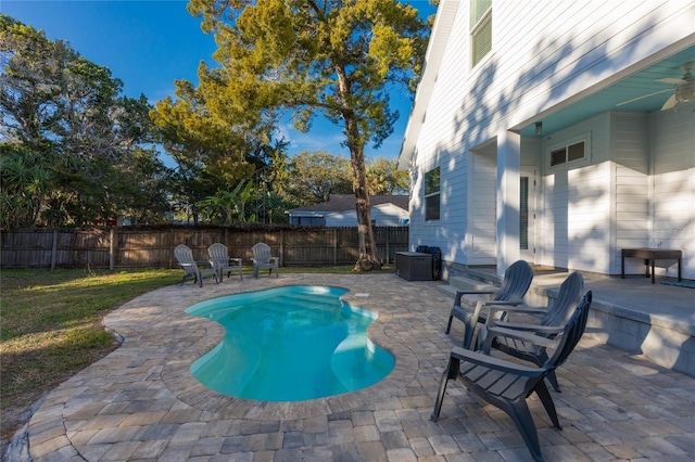 view of pool featuring a patio and a lawn