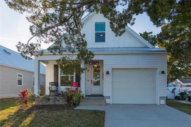 view of front of property with a porch and a garage