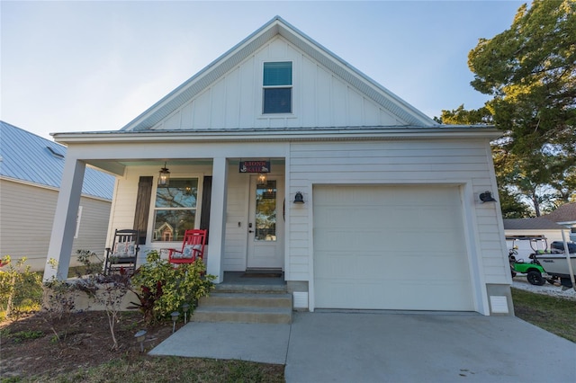 view of front facade featuring a porch and a garage