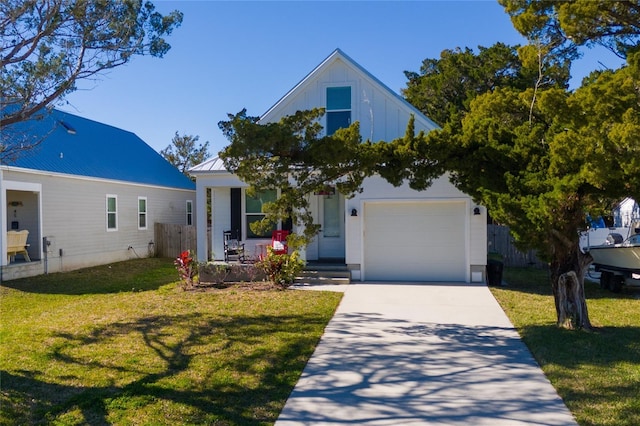 view of front of property with a garage and a front yard