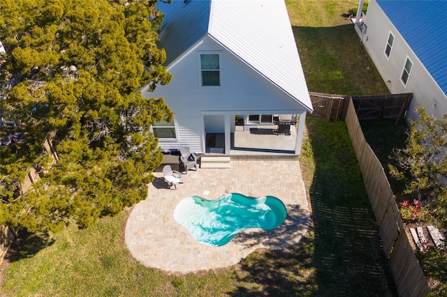 back of house with a patio